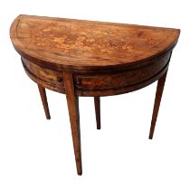 A 19th century continental mahogany and marquetry D-shaped card table - the hinged top decorated