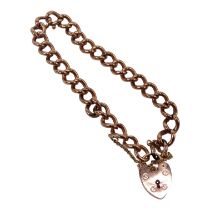 A 9ct gold curb link bracelet - with heart shaped lock, 8.8g