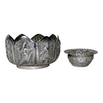 A late 19th century Burmese white metal bowl - of lotus form and repousse decorated with dancing