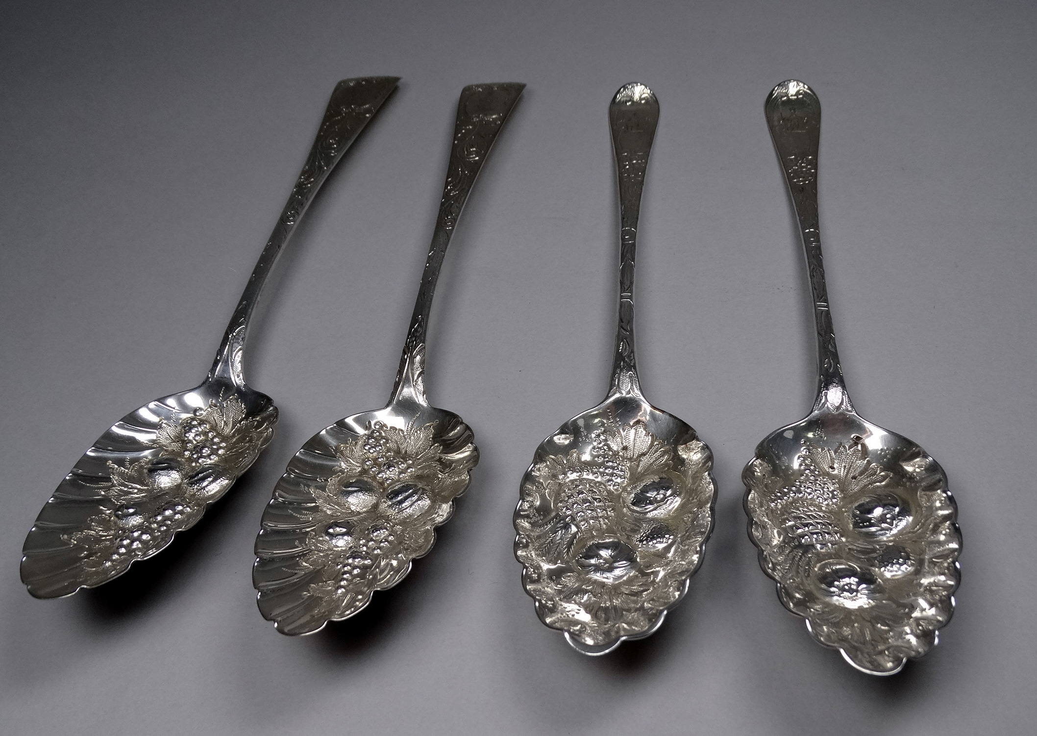 A pair of silver berry spoons - Exeter 1821, George Ferris, with later repousse and engraving,