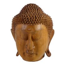 A contemporary carved hardwood head of Buddha - East Asia, height 25cm.