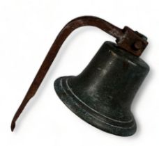 A 19th/20th century bronze bell - with iron bracket and clapper, height 32cm.