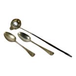 A pair of silver spoons - indistinct London marks, weight 110g, together with a white metal punch