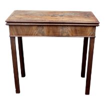 A George III mahogany tea table - the rectangular top with cross banding above a gateleg action,