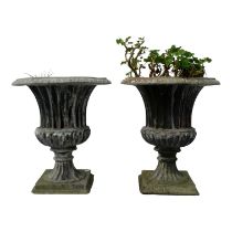 A pair of lead garden urns - of fluted campana form, raised on square bases, height 49cm. (2)