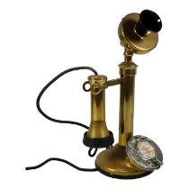 A vintage brass candlestick telephone - with Bakelite fittings, height 32cm.