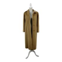 An Aquascutum ladies coat - fawn alpaca with a fawn satin lining, length 120cm.