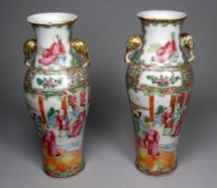 A pair of Chinese famille verte vases - of baluster form with elephant mask handles, decorated