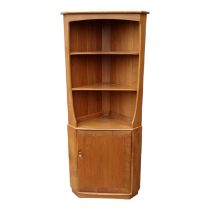 A vintage Ercol elm and beech 'Windsor' open corner cupboard - model 743C, the arrangement of