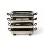 A set of four silver plated rectangular food warmers - dish shaped and engraved with armorial,