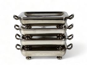 A set of four silver plated rectangular food warmers - dish shaped and engraved with armorial,