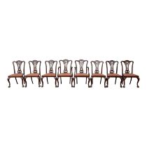 A set of eight George III style mahogany dining chairs - with carved and pierced vase shaped