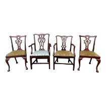 Two George III mahogany open arm chairs - with pierced vase shaped splats and square legs joined