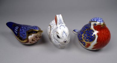 A Royal Crown Derby paperweight - modelled as a wren, together with two others modelled as another