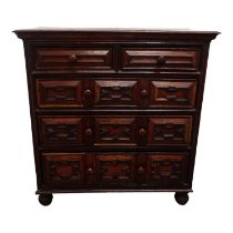 A late 17th century oak chest of drawers - the rectangular top above an arrangement of two short and