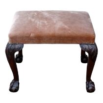 A George III and later reconstructed stool - the rectangular seat upholstered in fawn fabric, the