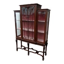 A mahogany Sheraton Revival breakfront display cabinet - with a central astragal door enclosing