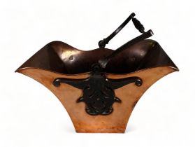 A late 19th century copper and wrought iron coal scuttle - of flared rectangular form with twisted