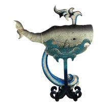 A automaton of a whale - rocking between waves with articulated spout and mouth, height 51cm.