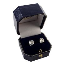 A pair of diamond ear studs set in platinum - total weight 3.35ct, each of cushion old cut, within a
