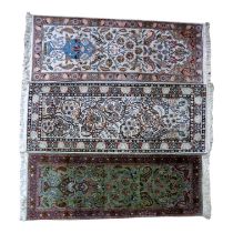 A small Persian runner - with garden design on a sage green ground, 121 x 47cm, together with two