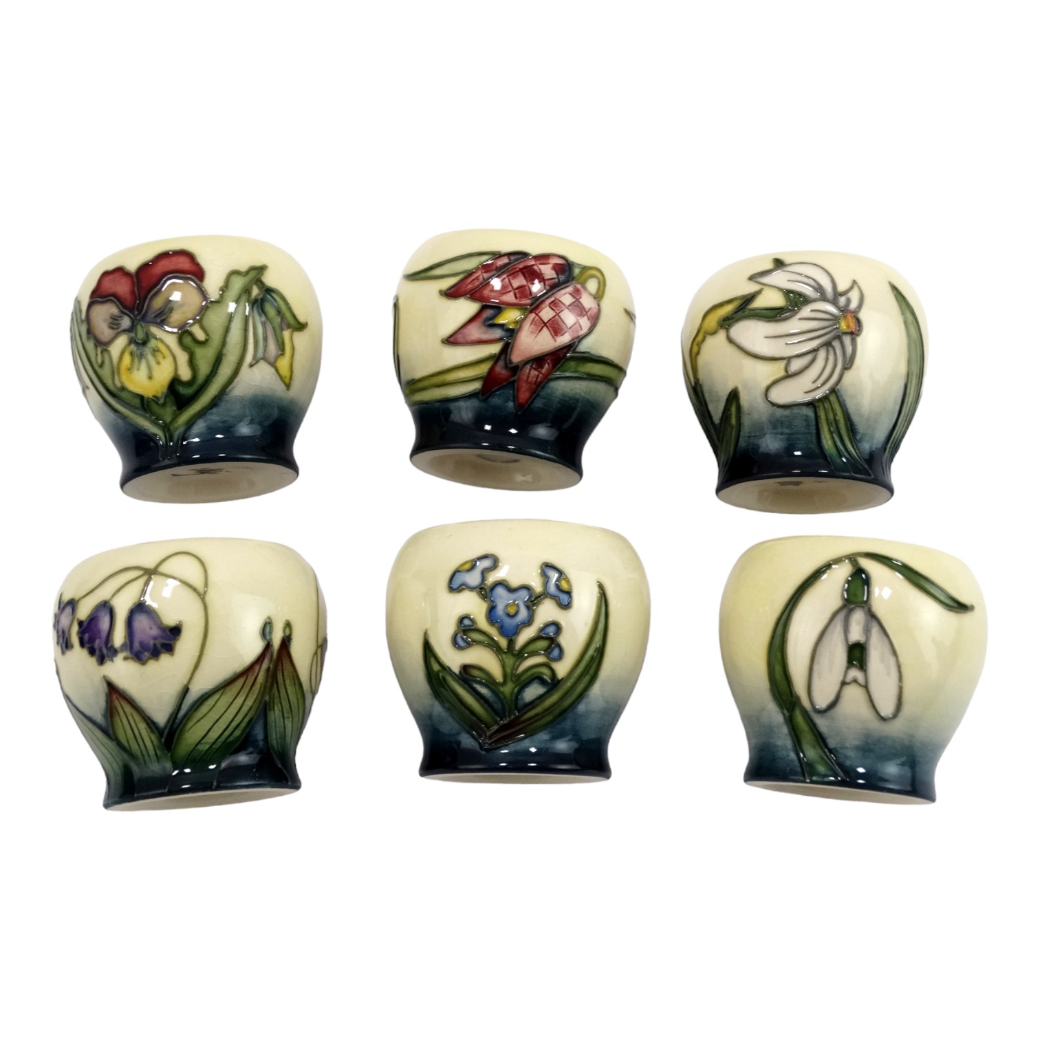 A boxed set of six Moorcroft Pottery eggcups - tubeline decorated with flowers, comprising 'Snakes - Image 3 of 5