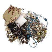 A quantity of costume jewellery - including necklaces, earclips and brooches, some on original