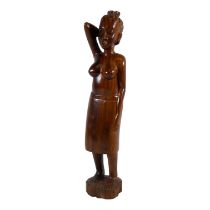 A carved hardwood figure of an African woman - height 45cm.