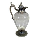 A late 19th century etched glass and mounted claret jug - the body with stars and foliate bands with