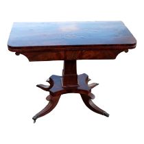 A William IV mahogany card table - the rectangular fold-over top above a square tapering support and