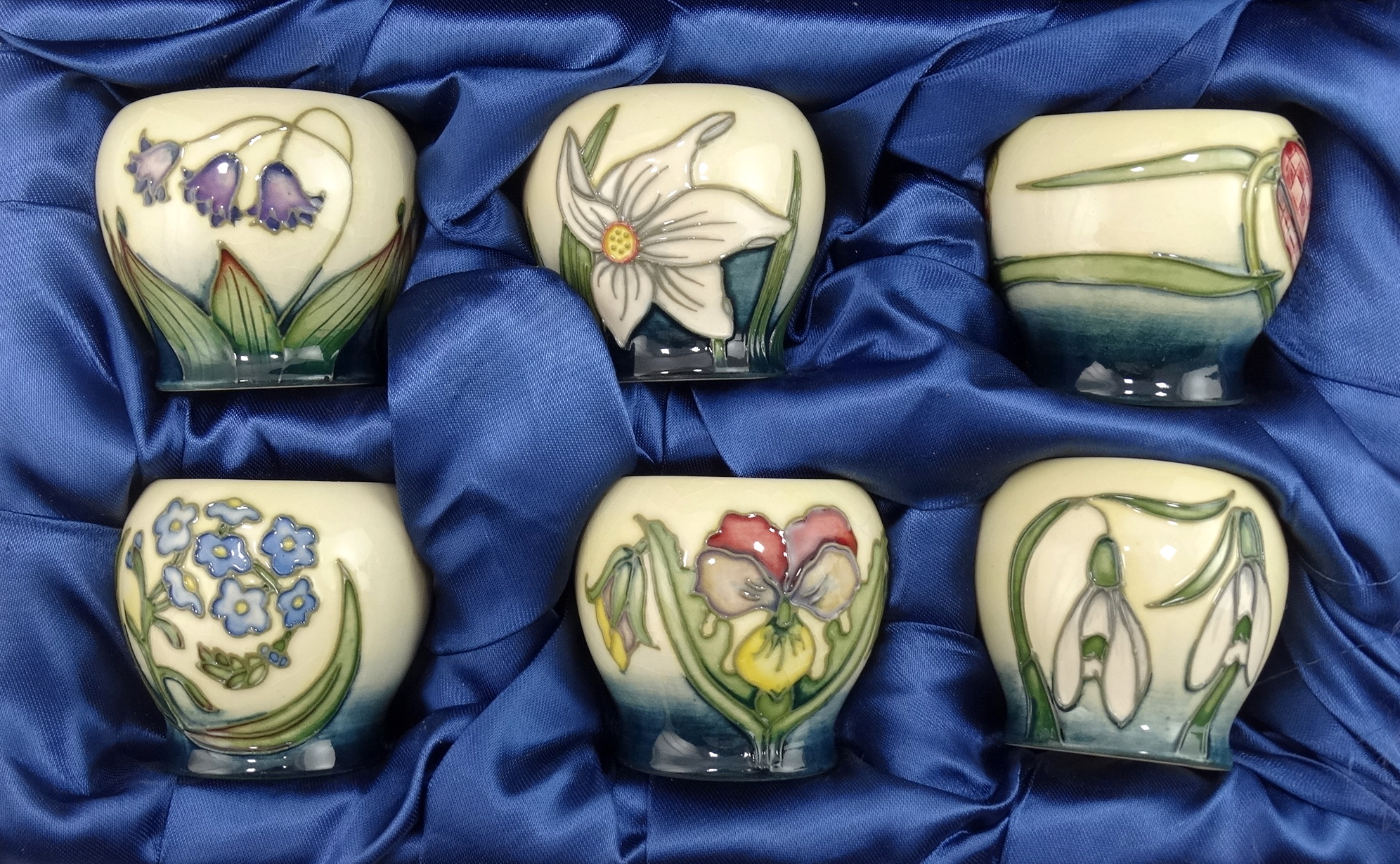 A boxed set of six Moorcroft Pottery eggcups - tubeline decorated with flowers, comprising 'Snakes - Image 2 of 5