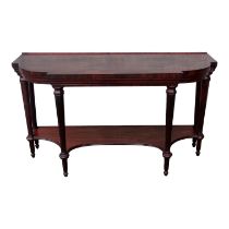 A late George III mahogany sideboard - the bowed breakfront rectangular top on six octagonal stop-