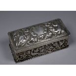 A silver rectangular box - London 1891, William Comyns & Sons, repousse decorated with birds and