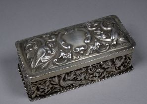 A silver rectangular box - London 1891, William Comyns & Sons, repousse decorated with birds and