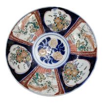 A 20th century Imari plate - decorated with floral vignettes, diameter 34cm.