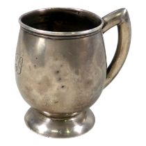 A silver christening mug - Sheffield 1938, engraved with initials and raised on a circular foot,