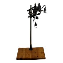 A 20th century industrial work lamp - formed from a photography enlarger, the pair of lamps