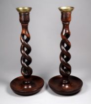 A pair of early 20th century barley twist candlesticks - with brass sconces and a turned dish