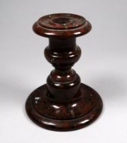 A late 19th/early 20th century turned serpentine candlestick - height 11cm.