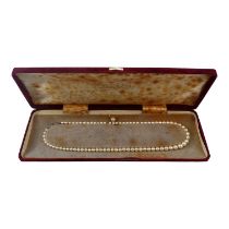 A graduated pearl necklace - with 9ct white gold diamond set clasp, 41cm long