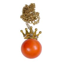 A 15ct gold set coral pendant - the bead on a coronet set with diamonds, on a fine vermeil chain,