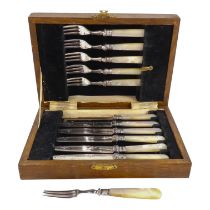 A boxed set of fruit eaters with silver ferrules - Sheffield 1937, with mother-of-pearl handles.