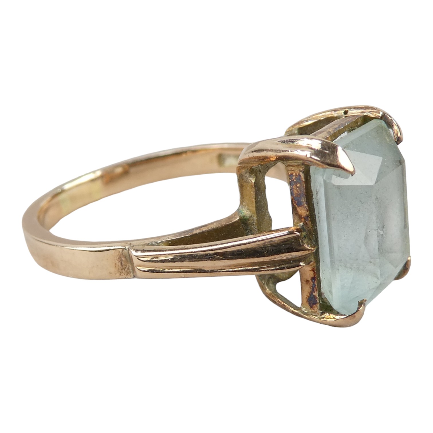 A 15ct gold ring - claw set with an emerald cut light blue stone, size O, weight 4.8g. - Image 2 of 4