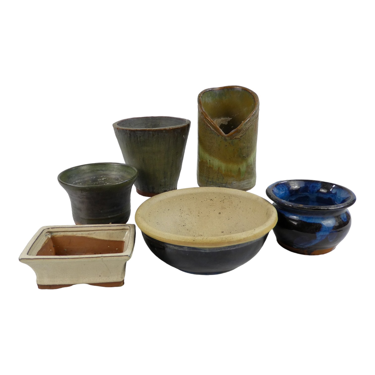 A quantity of 20th century glazed flower pots - a variety of colours and forms.