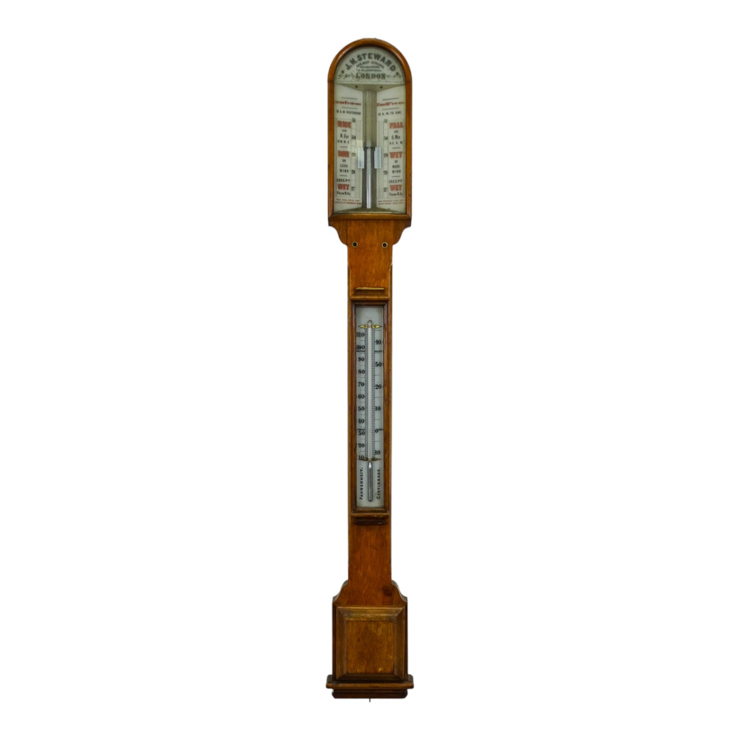 An early 20th century oak stick barometer - by J H Steward of London, with a pair of vernier