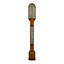 An early 20th century oak stick barometer - by J H Steward of London, with a pair of vernier