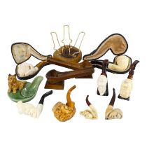 A late 19th century meerschaum pipe - the bowl modelled as the green man, with a amber stem,