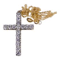 A yellow metal and diamond set cross - set with sixteen stones, on a fine 18ct gold chain, weight