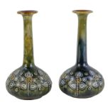 A pair of Royal Doulton stem vases - with tubeline foliate decoration, height 17cm. (2)