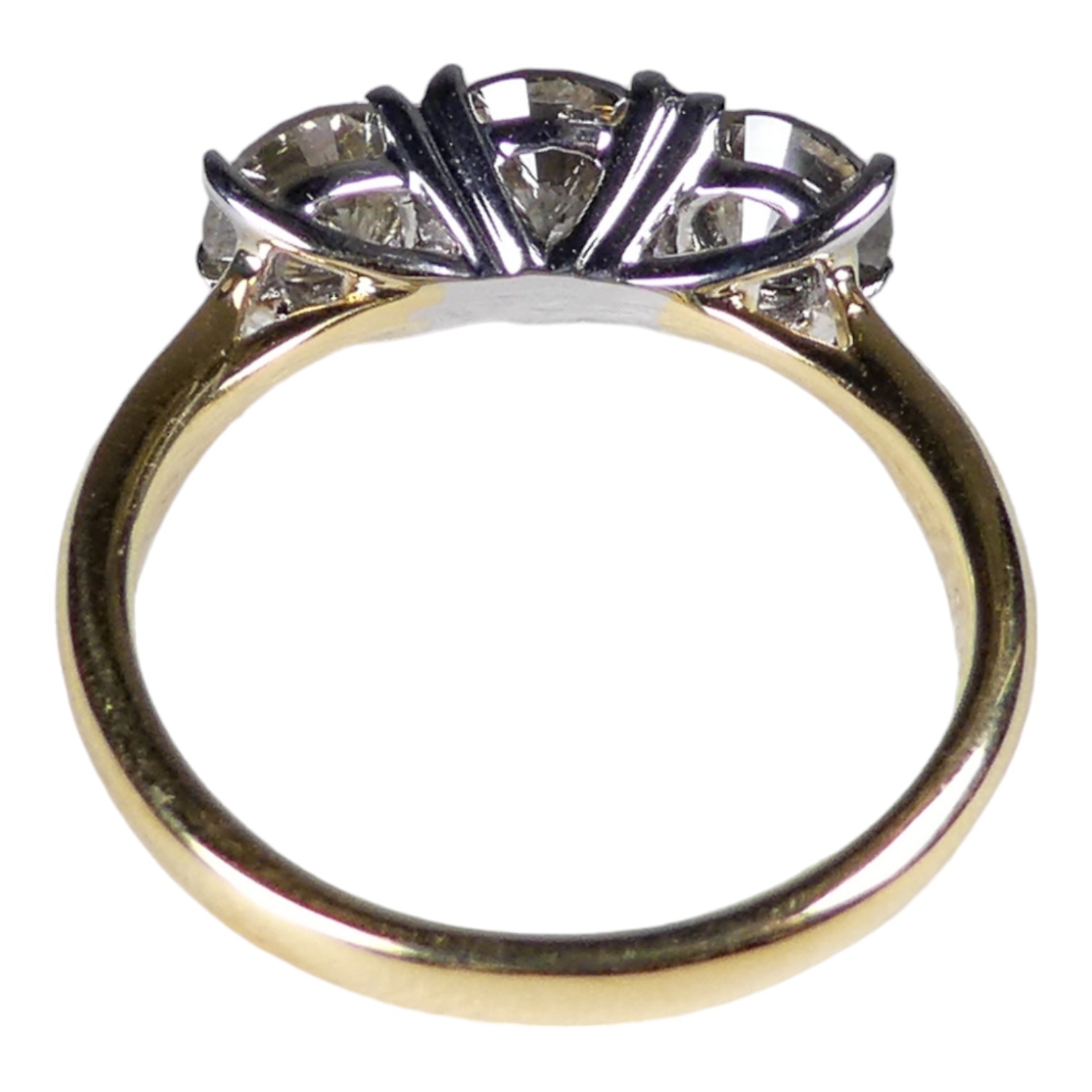 An 18ct white and yellow gold circular brilliant cut three stone diamond ring - diamond weight 1. - Image 2 of 4
